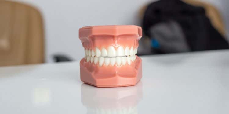 orange plastic container on white table